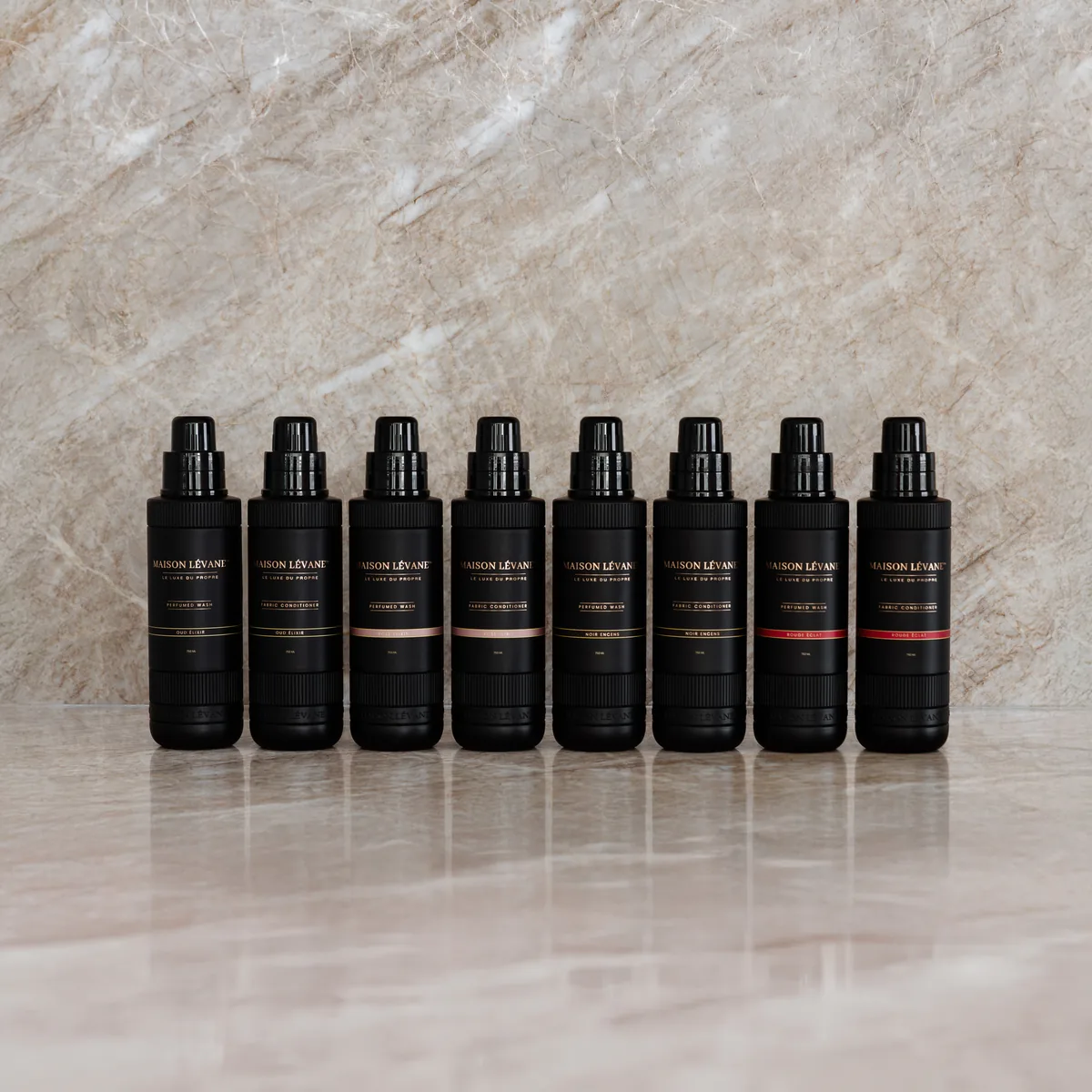 The full Maison Lévane laundry and fabric perfume collection on marble